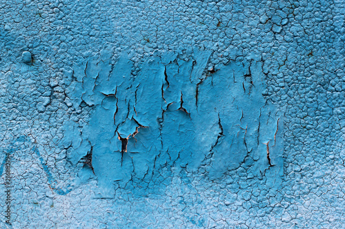 Blue surface of an old iron paint with three dimensional cubes of blue