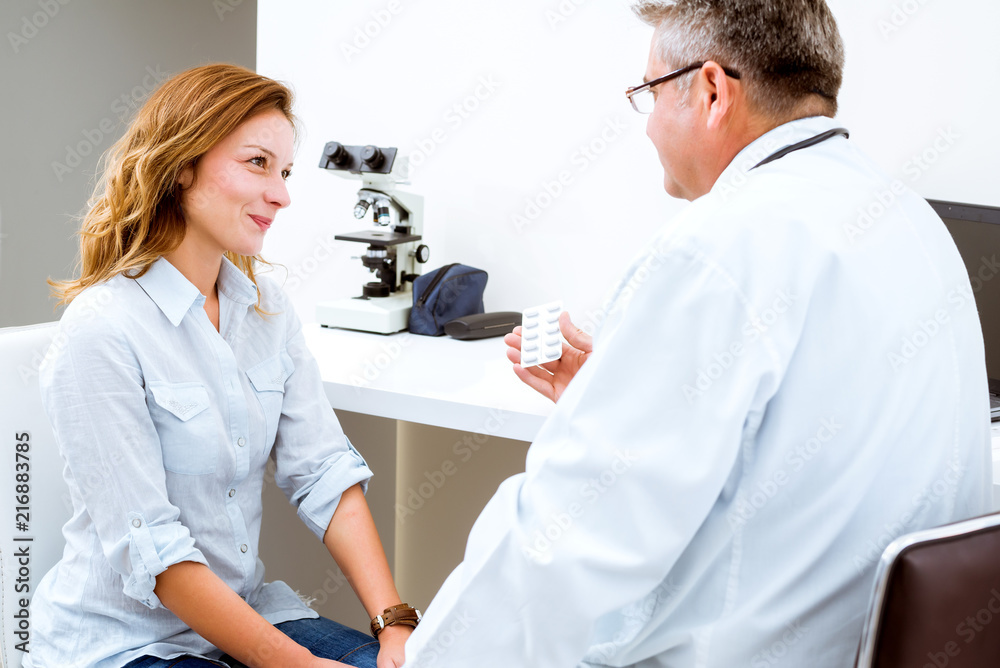 Offering his expert advice to his patient Offering his expert advice to his patient