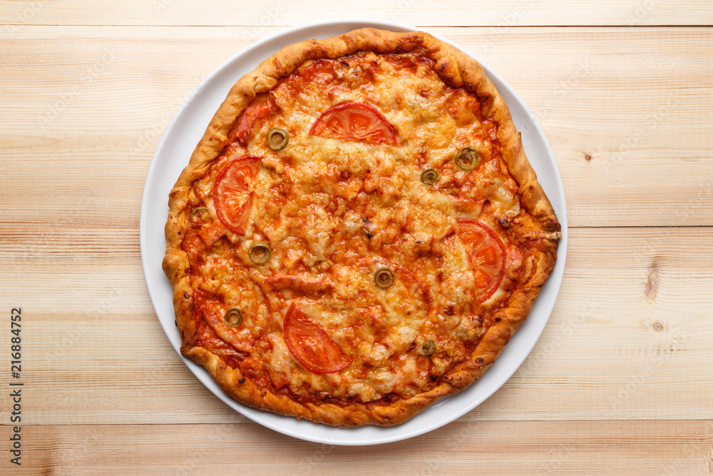 Homemade pizza on wooden table. Top view. Flat lay. Copy space Homemade pizza on wooden table. Top view. Flat lay. Copy space