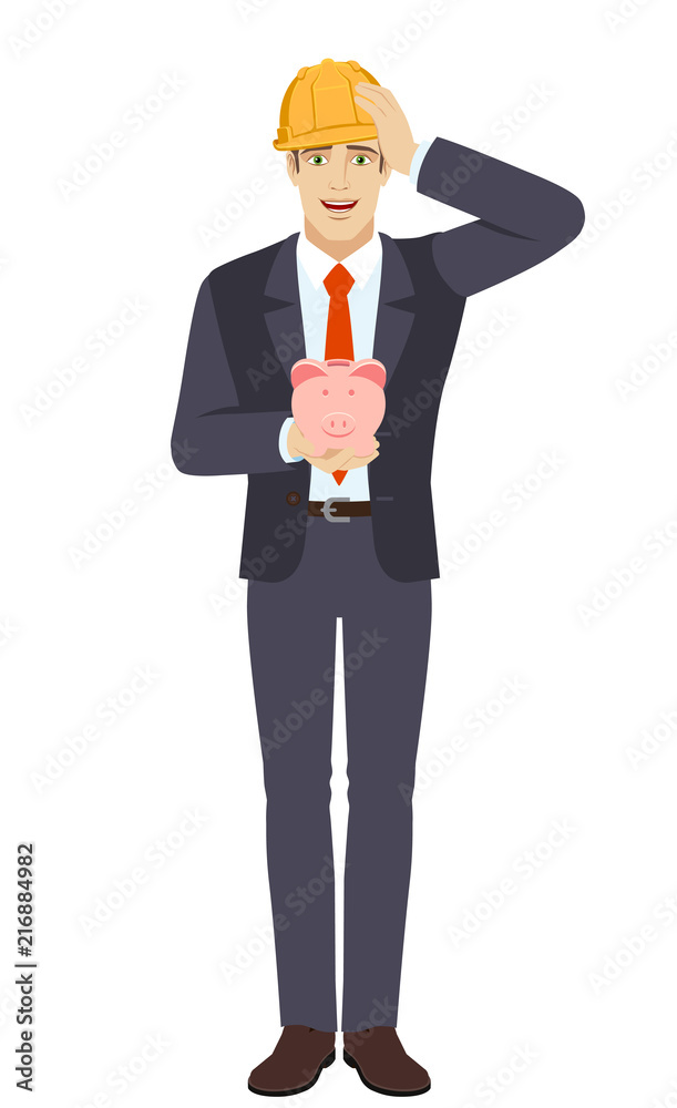 Businessman in construction helmet holding a piggy bank and grabbed his head Businessman in construction helmet holding a piggy bank and grabbed his head
