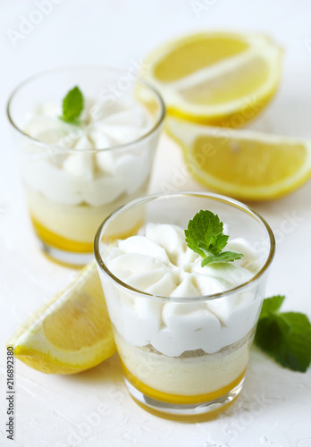 Limoncello - italian Dessert.  Lemon Cheesecake Mousse with Whipped Cream in cups. Summer dessert.