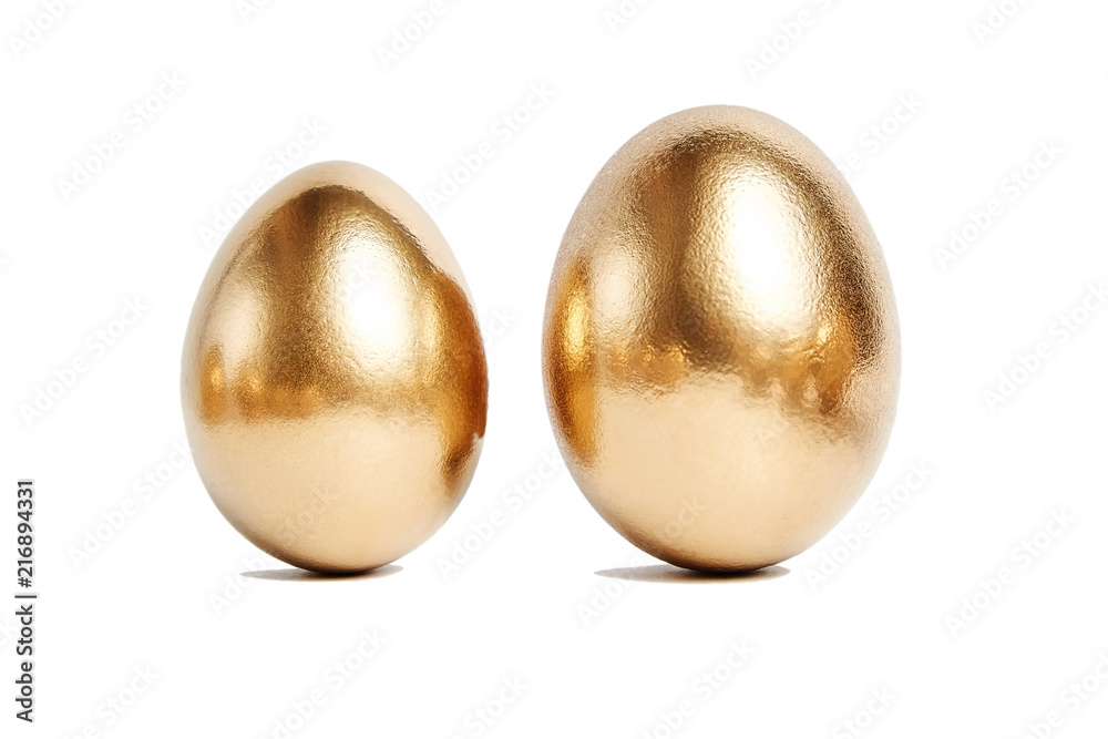 Two golden eggs isolated on white background. Conceptual image Two golden eggs isolated on white background. Conceptual image