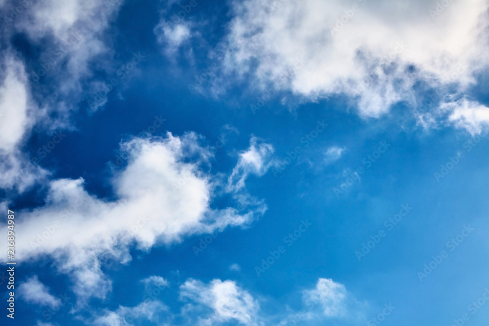 Obraz premium The blue sky with clouds. Spring, winter or summer heaven. Vivid background