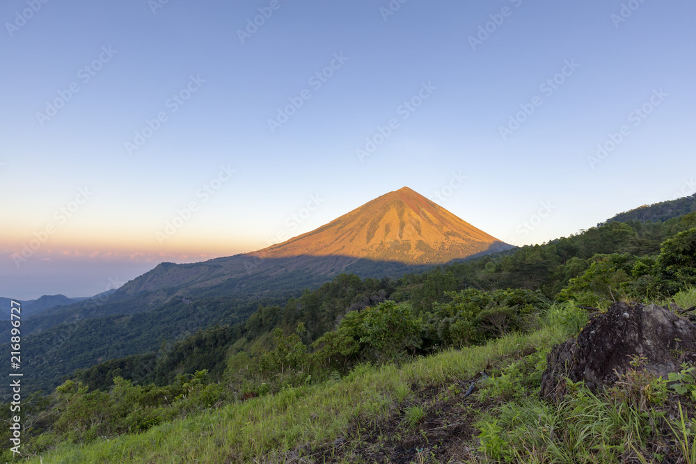 Dawn light hits Mount Inerie, a volcano in Flores, Indonesia.