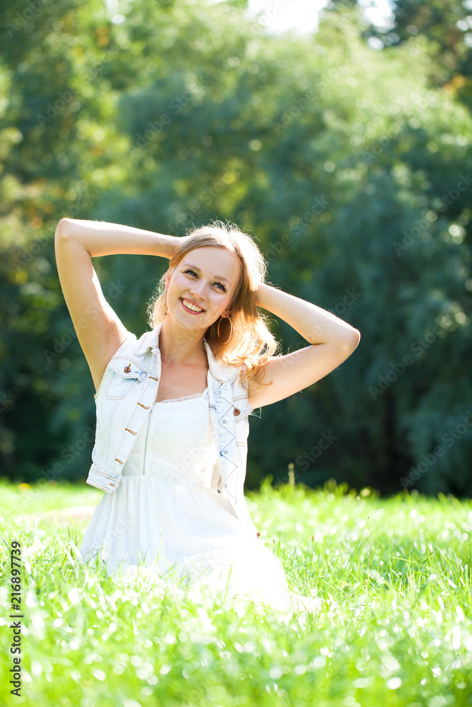 Young beautiful blonde woman in white dress Young beautiful blonde woman in white dress
