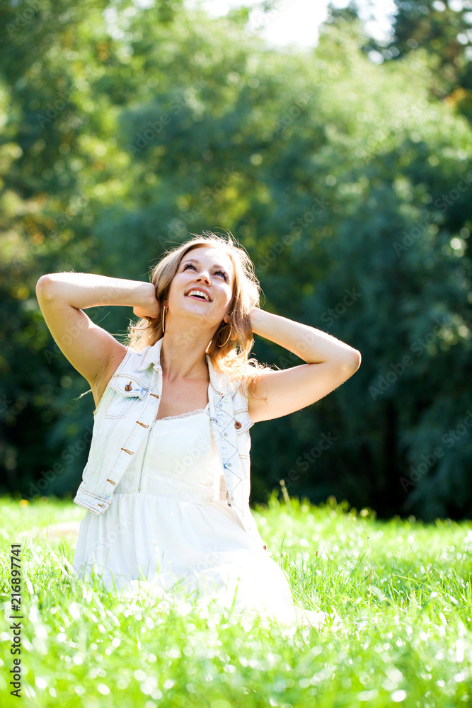 Young beautiful blonde woman in white dress Young beautiful blonde woman in white dress