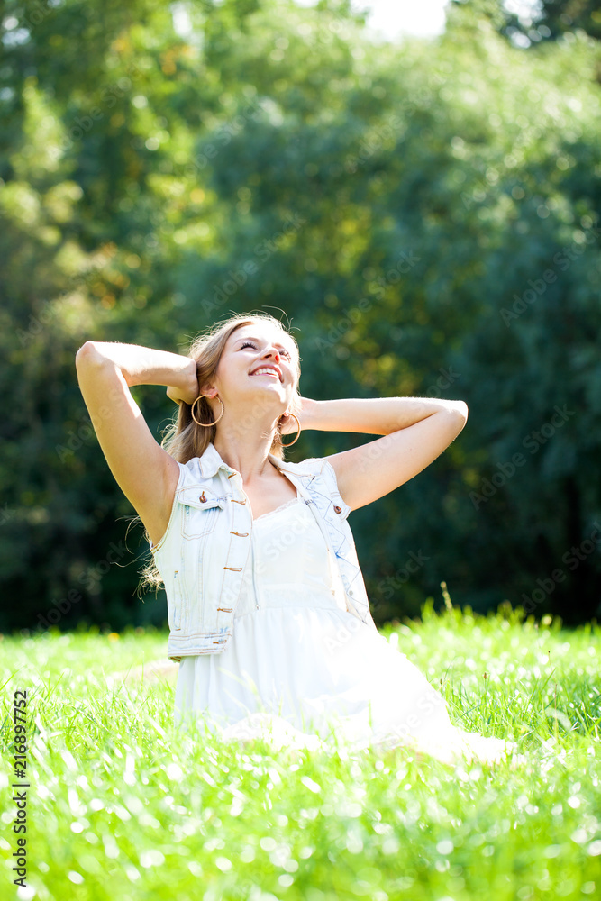 Young beautiful blonde woman in white dress Young beautiful blonde woman in white dress
