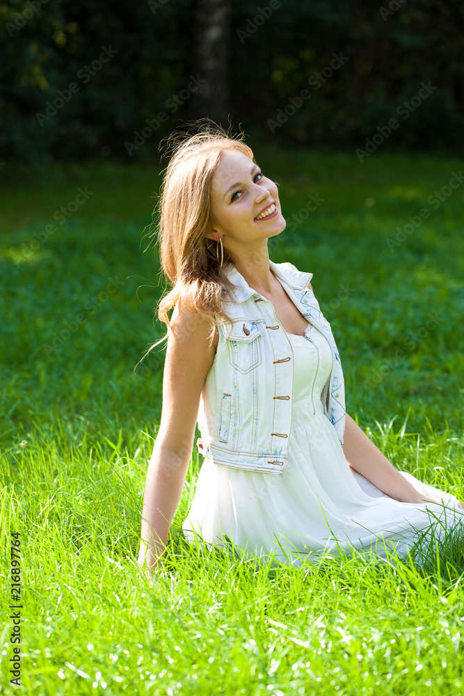 Young beautiful blonde woman in white dress Young beautiful blonde woman in white dress