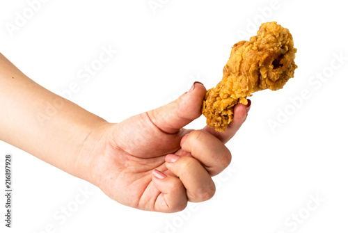 Fried chicken in hand close-up on white background. photo
