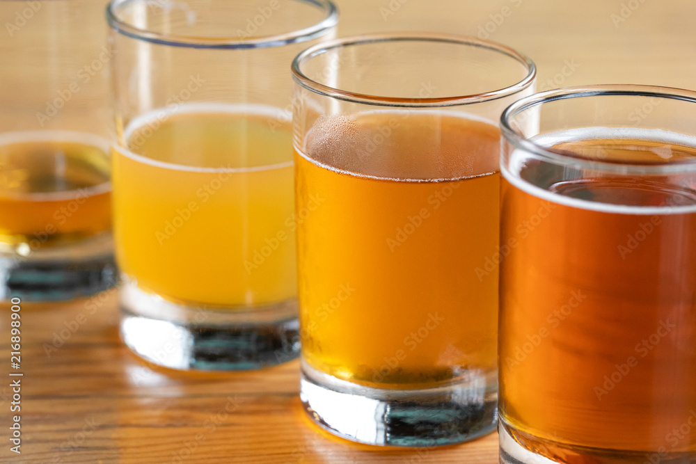 Close up on a row of beer glasses with ascending volumes Close up on a row of beer glasses with ascending volumes