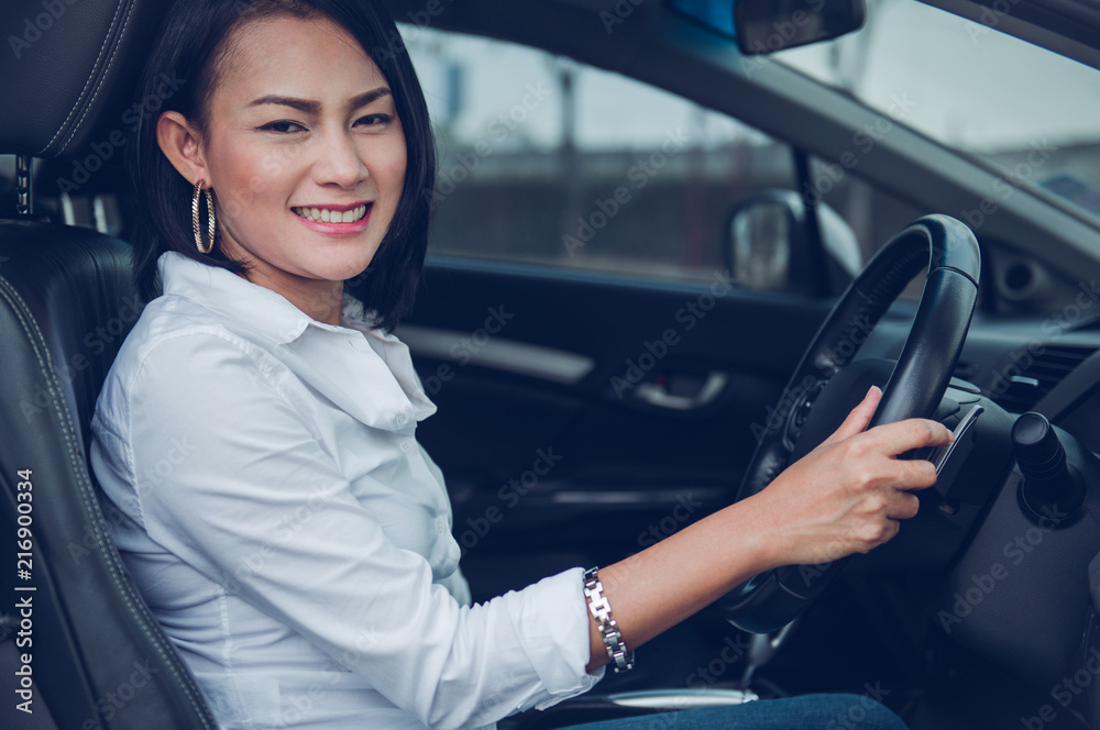 Asian woman driving a car happy mood. Asian woman driving a car happy mood.