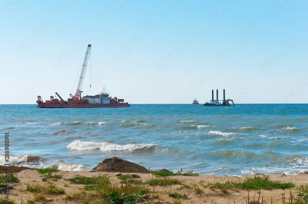 Marine petroleum platform. Drilling rig oil rig at sea. A drilling rig in the sea. Offshore oil wells.