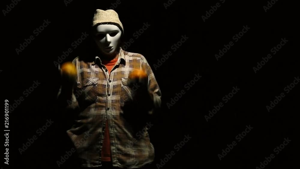 Ghost dances with pumpkins on Halloween