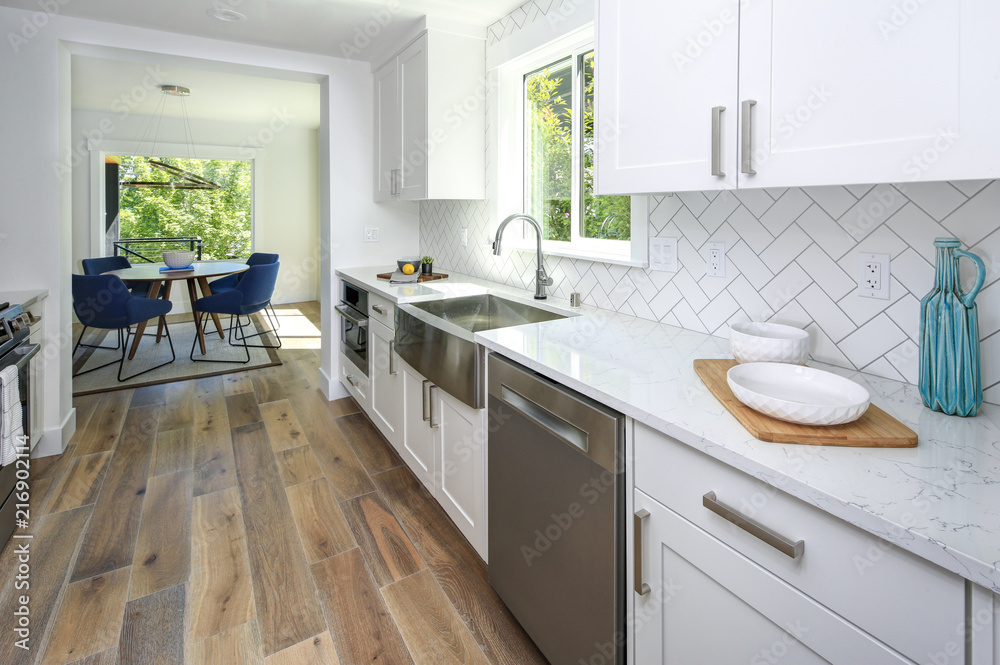 Remodeled kitchen with pure white cabinets. - obrazy, fototapety, plakaty 