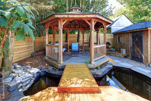 Fabulous gazebo with a pond in the back yard. photo