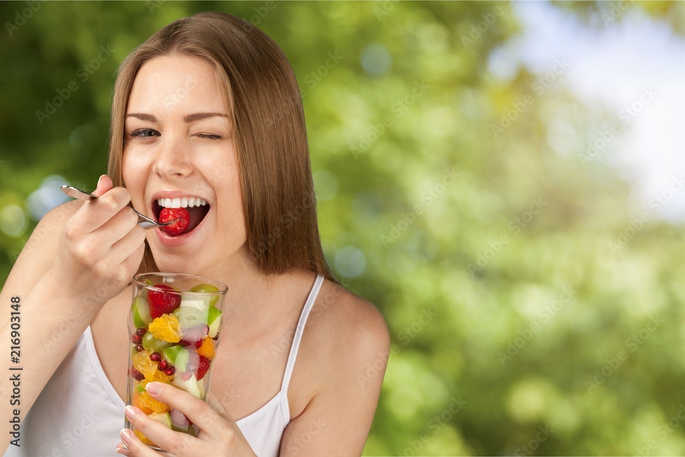Attractive caucasian woman with fruit salad Attractive caucasian woman with fruit salad