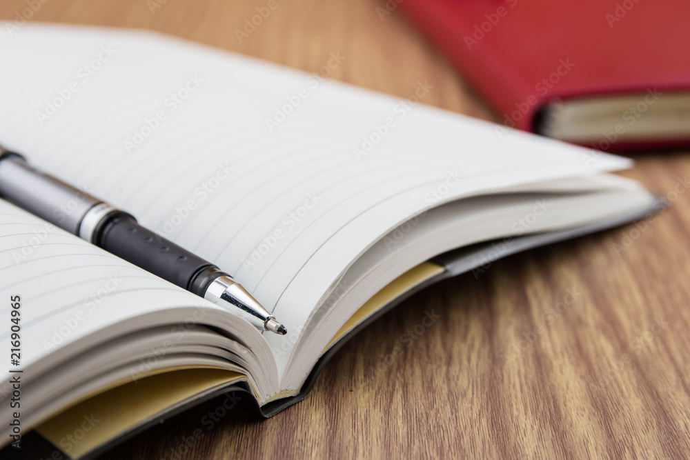book with pen, mobile and keyborad on desk book with pen, mobile and keyborad on desk