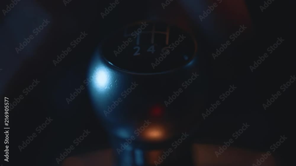 Car Interior - Shifting / Changing Gear Stick in Manual Car, Close Up, Night Time with Street Lights