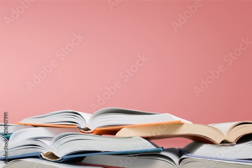 Stack of books on background