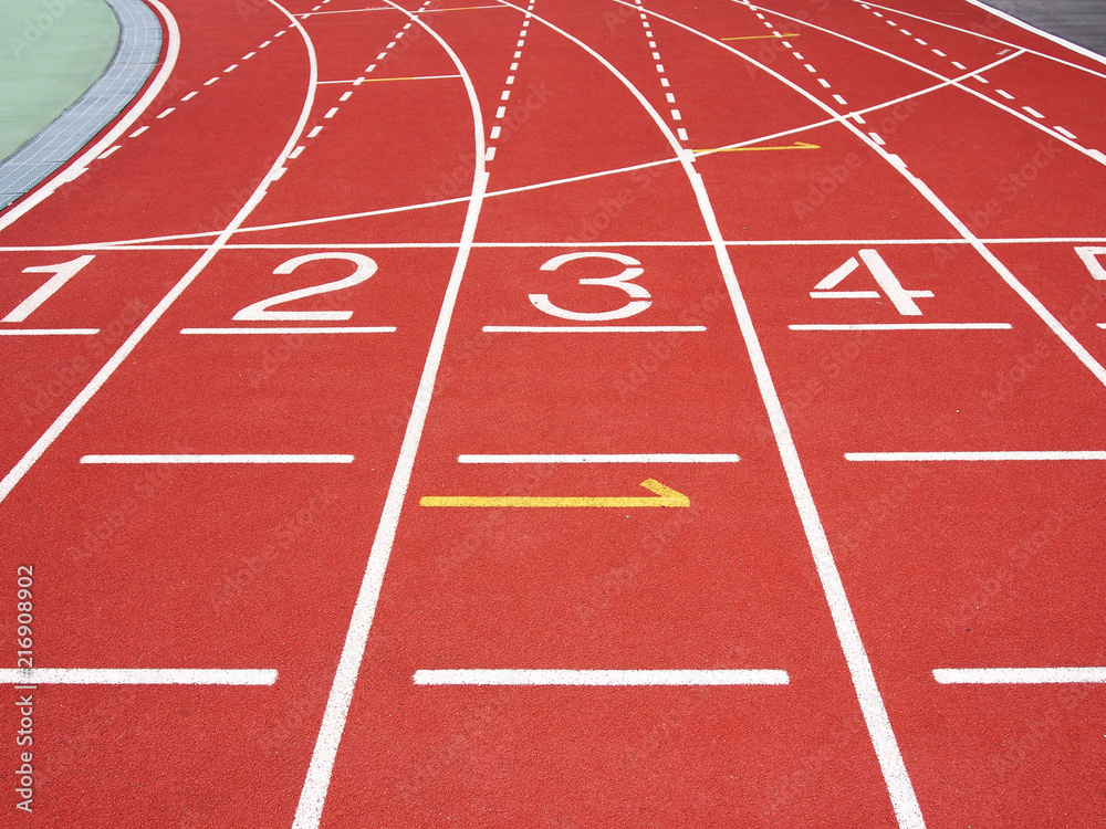  Red running track with numbers at the stadium