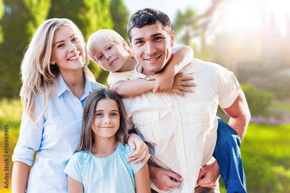 Beautiful smiling Lovely family on park Beautiful smiling Lovely family on park