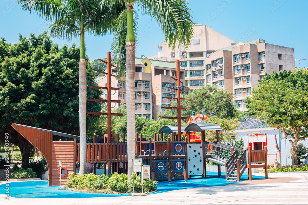 Playground and tropical palm trees at Stanley in Hong Kong