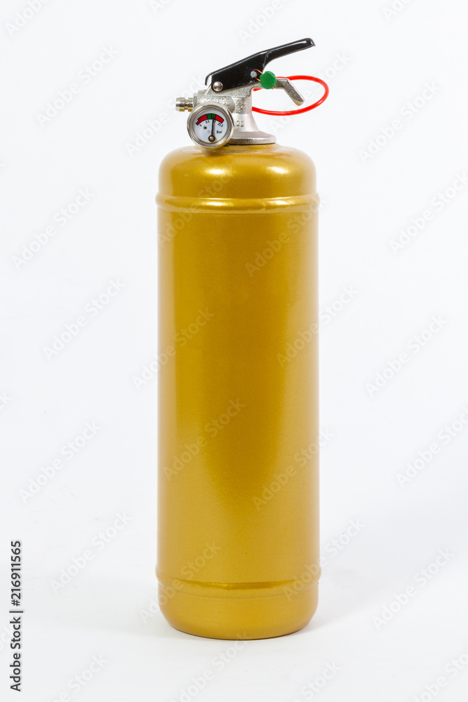 Obraz premium Gold Colored retro fire extinguisher isolated on white background