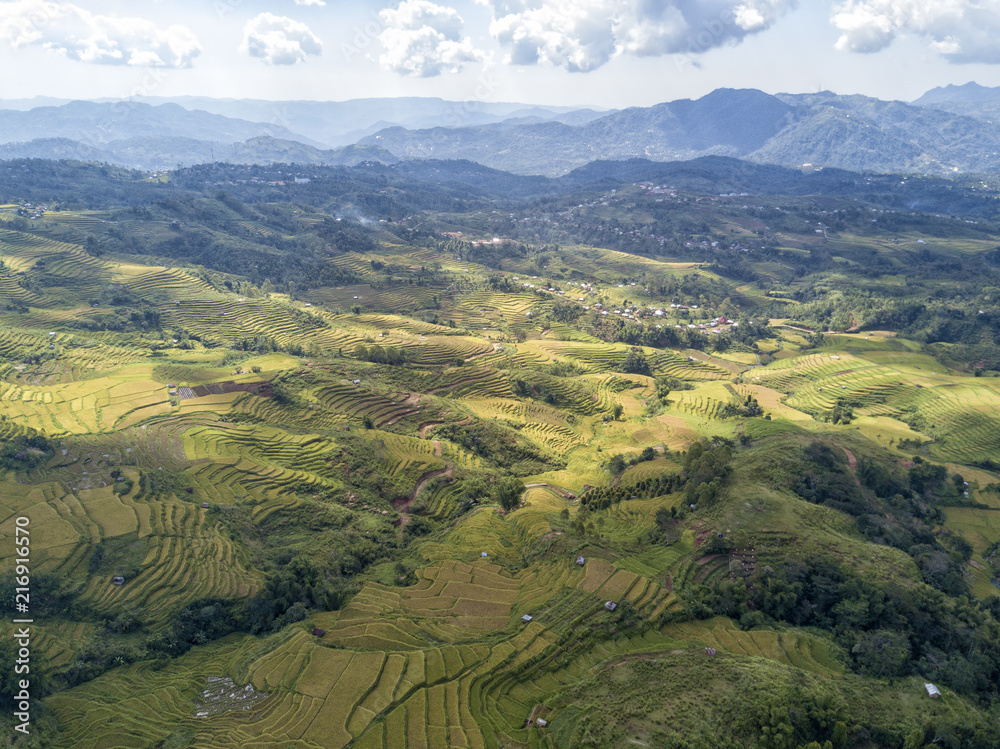 Aerial landscape photograph near the Golo Cador Rice Terraces in Ruteng on Flores, Indonesia.