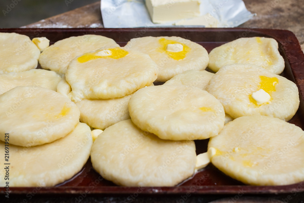 Cooked khachapuri bread with suluguni cheese and butter. Georgian traditional food. Cooked khachapuri bread with suluguni cheese and butter. Georgian traditional food.