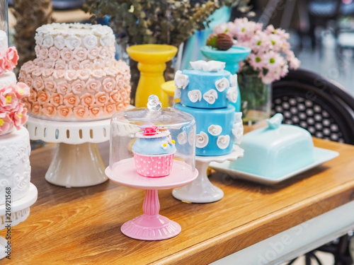 colorful fancy cake on white cakestand photo