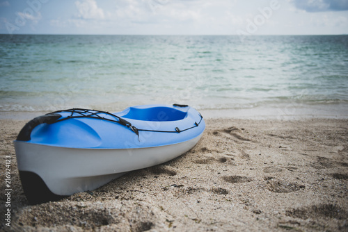 Blue Kayak Placed On The Beach