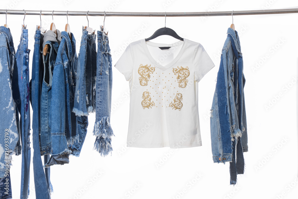 Female shirts dress ,shorts jeans, with mix jeans shirt, jacket isolated on hanging Female shirts dress ,shorts jeans, with mix jeans shirt, jacket isolated on hanging