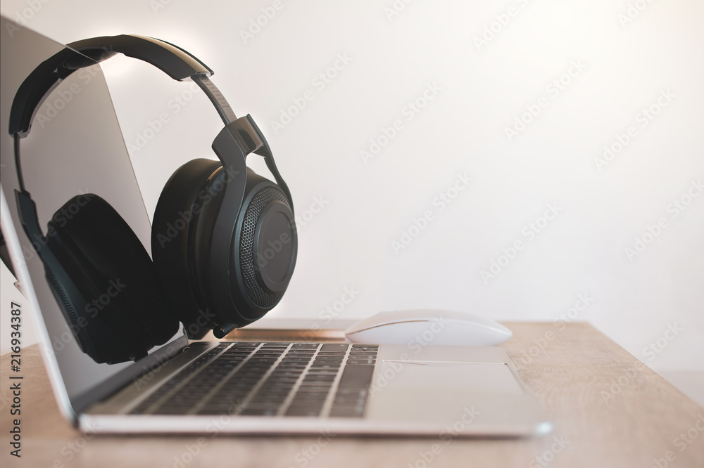 Headphones black, smartphone and laptop on Work Desk. Headphones black, smartphone and laptop on Work Desk.