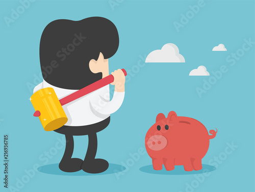 businessman with hammer in his hand ready to smash the piggy bank