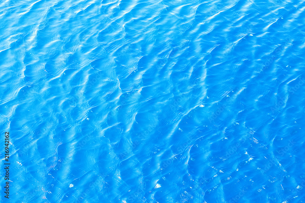 Shining blue wavy water surface ripple background