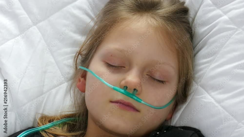 Little Girl Lying In The Bed Sleeping. Oxygen supply 04 Little Girl Lying In The Bed Sleeping. Oxygen supply 04