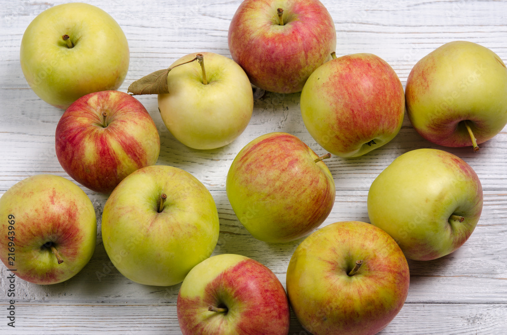 Ripe apples on a wooden table. Apples close-up. Top view. Ripe apples on a wooden table. Apples close-up. Top view.