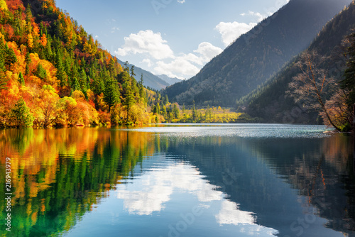 Scenic view of the Panda Lake. Autumn forest reflected in water
