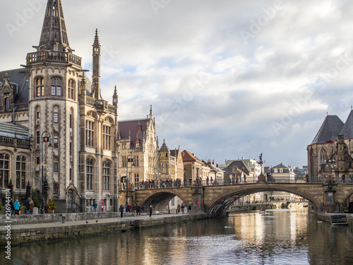 Gent - Medieval cathedral and bridge over a canal in Ghent  Belgium. December  2017