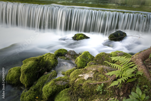 Waterfalls with mossy rocks background. Long exposure used. Kamnik Bistrica, Slovenia.