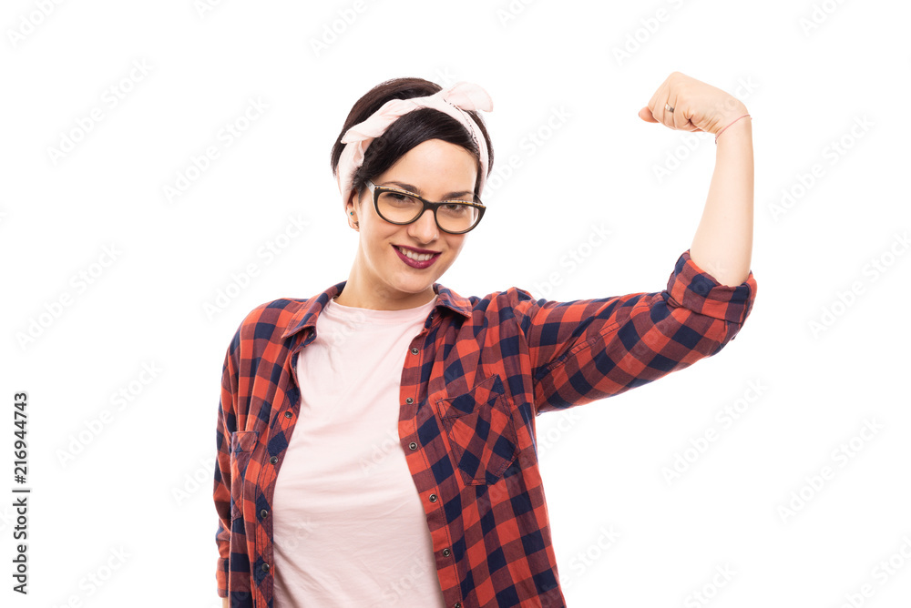 Pretty pin-up girl wearing glasses showing her biceps. Pretty pin-up girl wearing glasses showing her biceps.