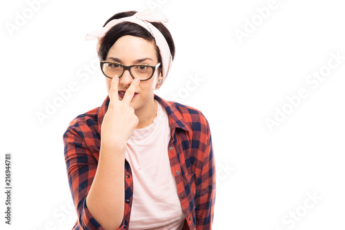 Young pretty pin-up girl showing look into my eyes gesture.