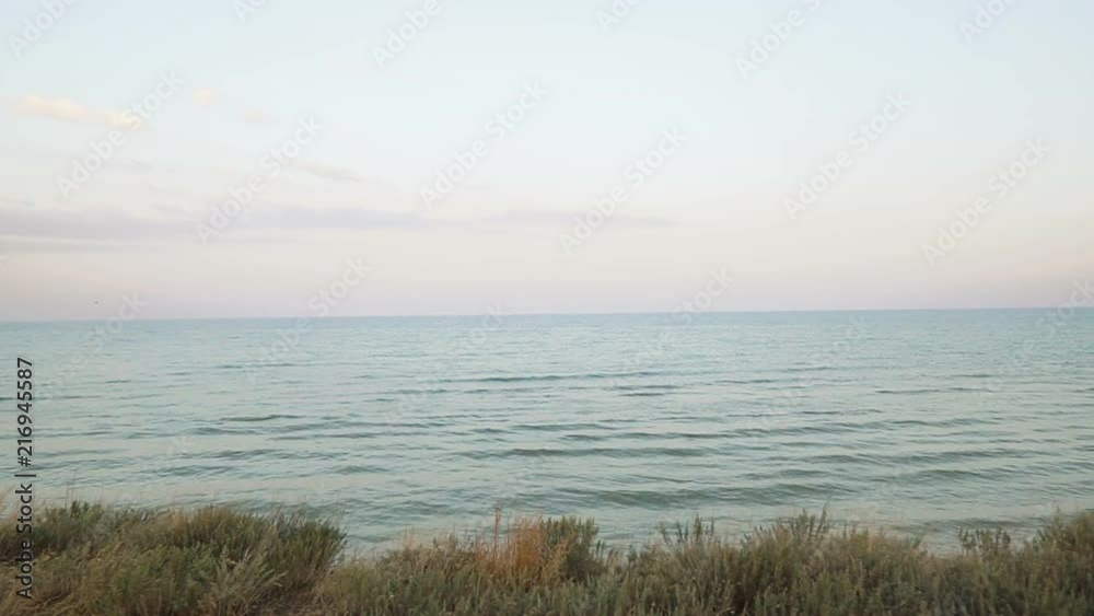 Sea view on the edge of the cliff, pan shot. Ocean panorama. Sea view on the edge of the cliff, pan shot. Ocean panorama.