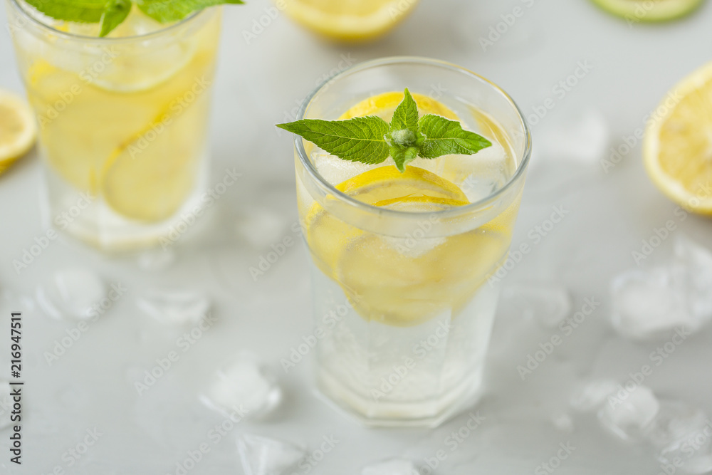 Alcoholic drink (gin and tonic) with lemon, lime, mint and ice. Alcoholic drink (gin and tonic) with lemon, lime, mint and ice.