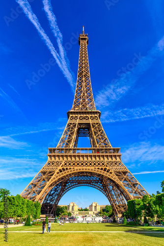 Paris Eiffel Tower and Champ de Mars in Paris, France. Eiffel Tower is one of the most iconic landmarks in Paris. The Champ de Mars is a large public park in Paris © Ekaterina Belova