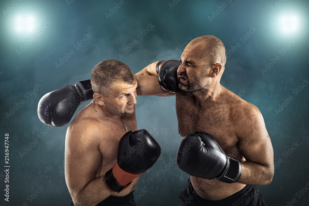 Two professional boxers, athletes in dynamic boxing action