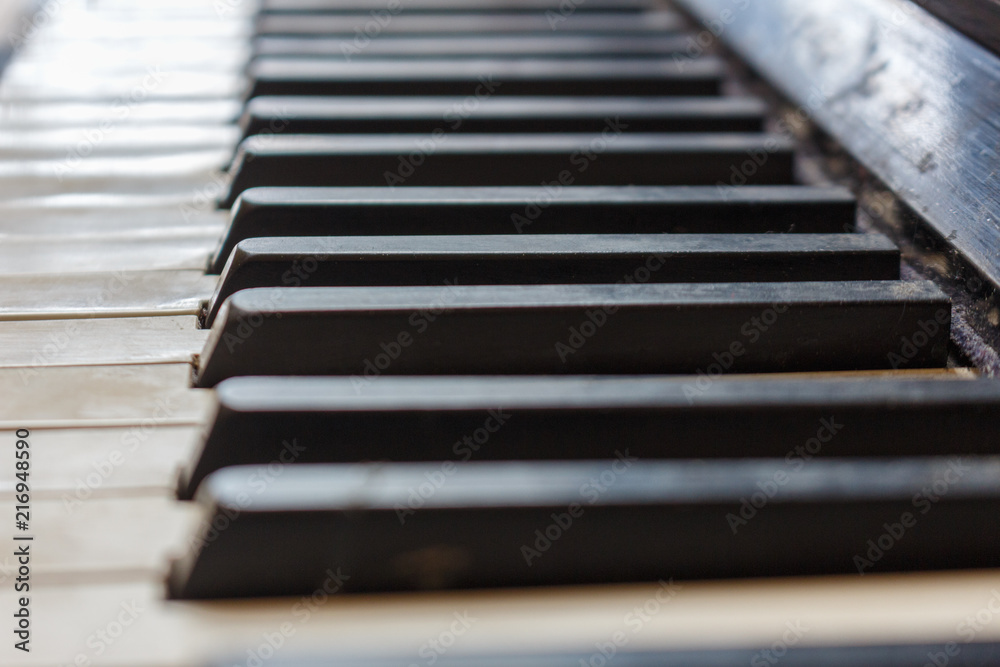 Closeup of old piano keyboard shallow focus Closeup of old piano keyboard shallow focus
