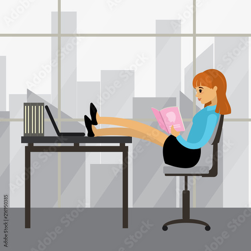 Business woman relaxes and reads a magazine or catalog,female in modern office