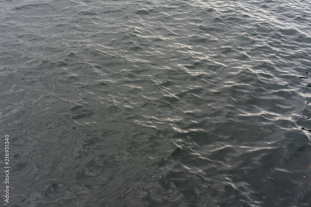 background - lake water with waves on a cloudy day background - lake water with waves on a cloudy day