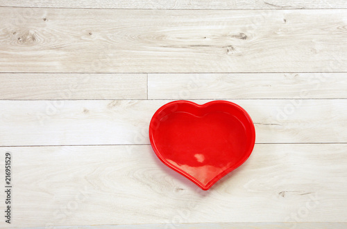 hart / Red hart frame on a wooden background